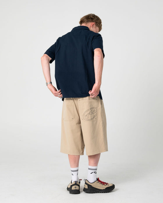 man-wearing-diego-short-sleeve-shirt-in-navy-blue