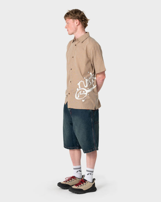 man-wearing-spray-n-pray-short-sleeve-shirt-in-pinecone