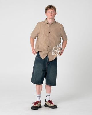 Man wearing Spray N Pray Short Sleeve Shirt in Pinecone