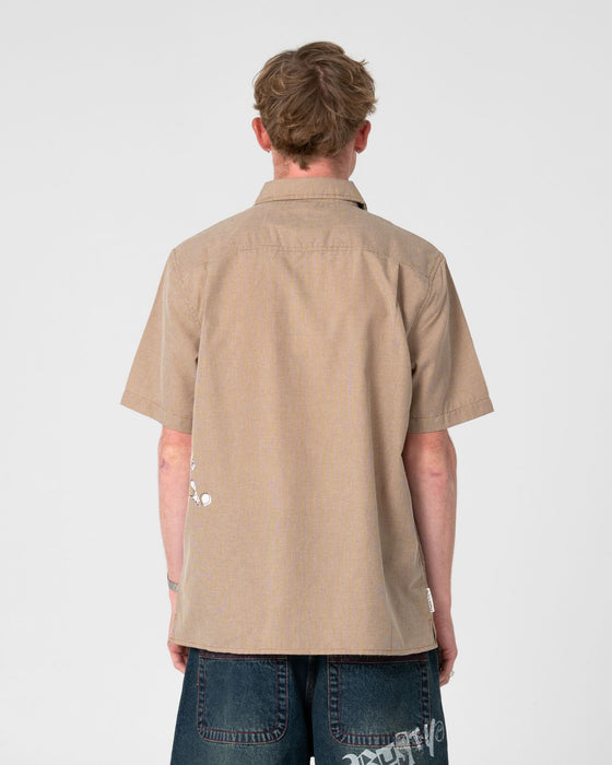 man-wearing-spray-n-pray-short-sleeve-shirt-in-pinecone