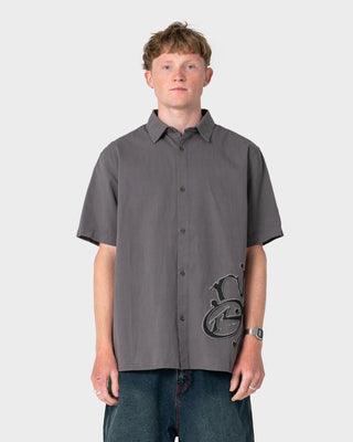 Man wearing Spray N Pray Short Sleeve Shirt in Steel