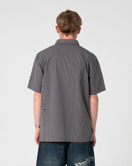 man-wearing-spray-n-pray-short-sleeve-shirt-in-steel