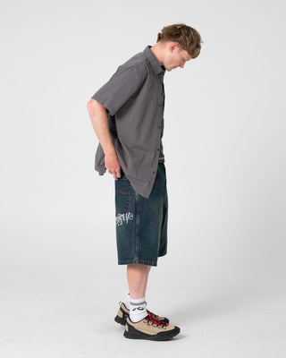 Man wearing Spray N Pray Short Sleeve Shirt in Steel