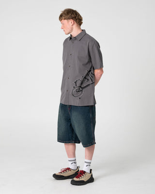 Man wearing Spray N Pray Short Sleeve Shirt in Steel