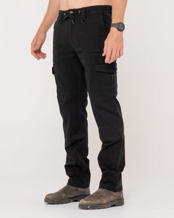 man-wearing-obligation-cargo-pant-in-black
