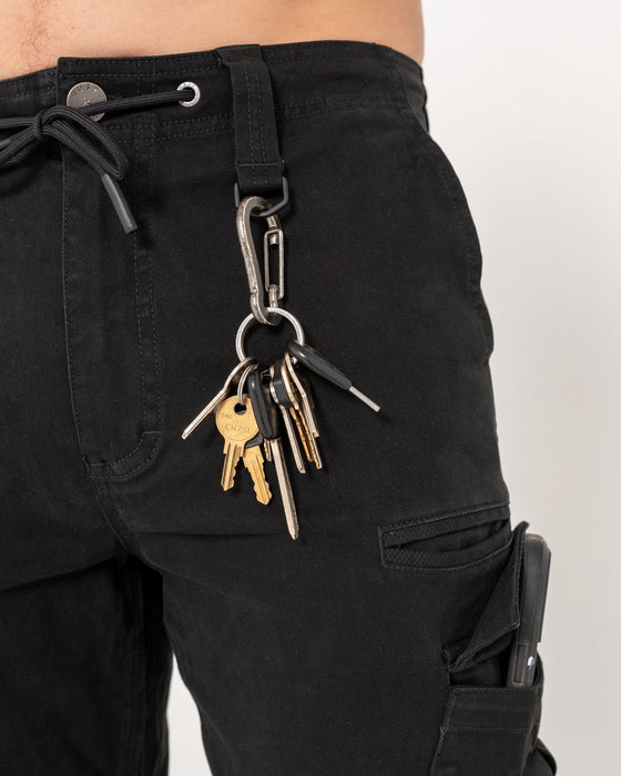 man-wearing-obligation-cargo-pant-in-black