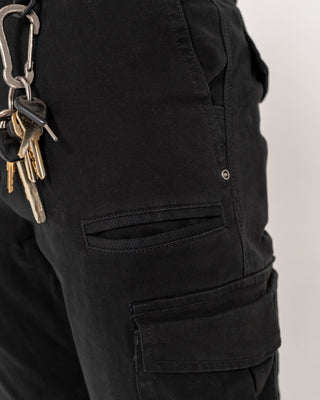 Man wearing Obligation Cargo Pant in Black