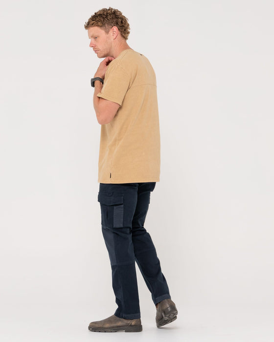 man-wearing-obligation-cargo-pant-in-navy-blue