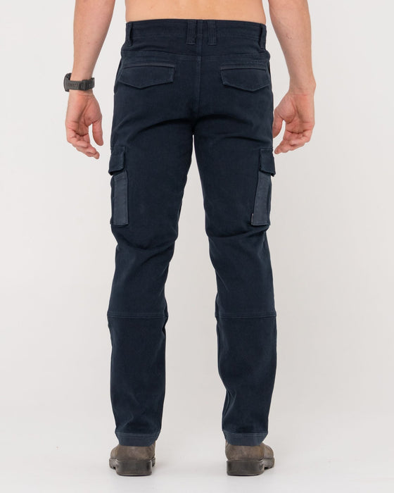 man-wearing-obligation-cargo-pant-in-navy-blue