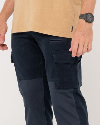 Man wearing Obligation Cargo Pant in Navy Blue