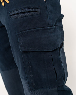 Man wearing Obligation Cargo Pant in Navy Blue