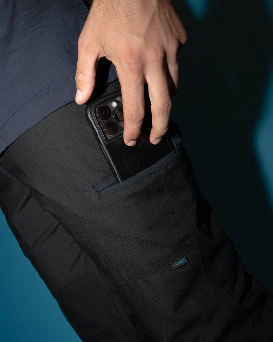 man-wearing-tr245-9-pocket-stretch-work-pant-in-black