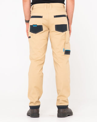 Man wearing Tr245 9 Pocket Stretch Work Pant in Trade Khaki