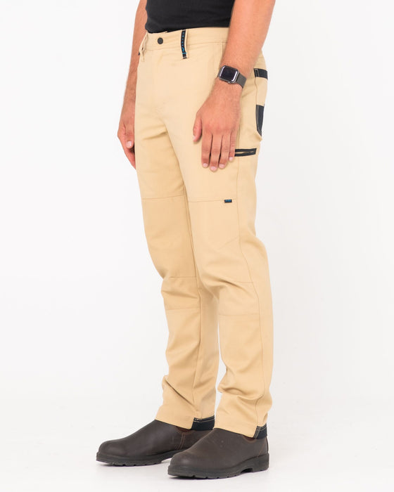 man-wearing-tr245-9-pocket-stretch-work-pant-in-trade-khaki
