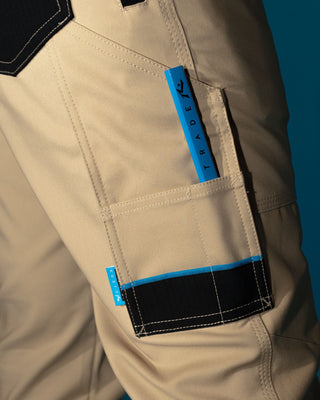 Man wearing Tr245 9 Pocket Stretch Work Pant in Trade Khaki