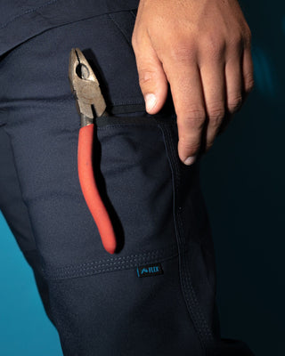 Man wearing Tr245 9 Pocket Stretch Work Pant in True Navy