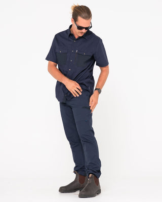 Man wearing Tr245 9 Pocket Stretch Work Pant in True Navy