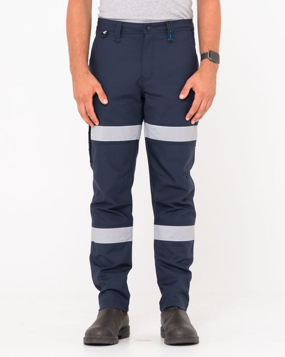 man-wearing-tr245r-9-pocket-stretch-pant-reflect-in-true-navy