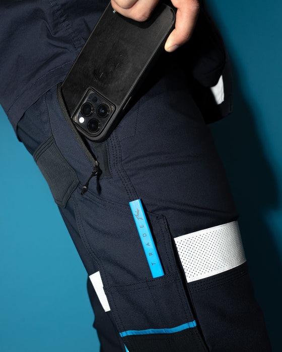 man-wearing-tr245r-9-pocket-stretch-pant-reflect-in-true-navy