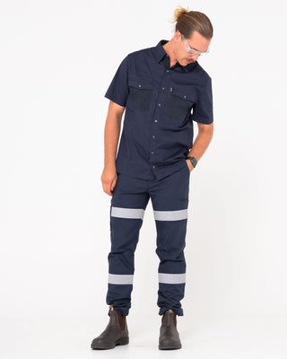 Man wearing Tr245r 9 Pocket Stretch Pant Reflect in True Navy
