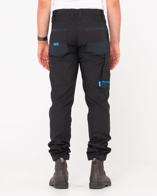 Man wearing Tr246 9 Pocket Stretch Work Pant Cuffed in Black