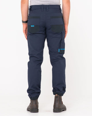 Man wearing Tr246 9 Pocket Stretch Work Pant Cuffed in True Navy
