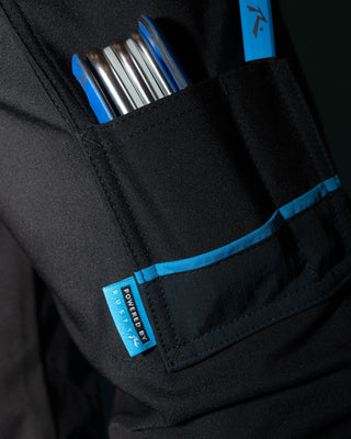 Man wearing Tr246 9 Pocket Stretch Work Pant Cuffed in True Navy