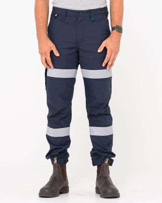 Man wearing Tr246r 9 Pkt Stretch Cuff Pant Reflect in True Navy