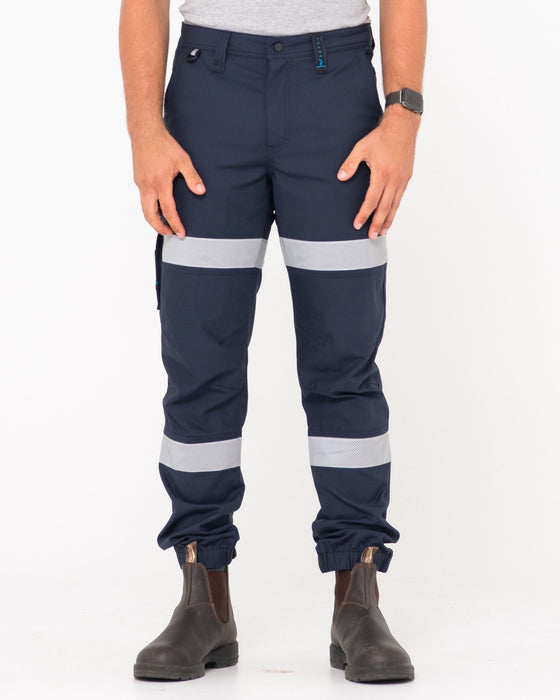man-wearing-tr246r-9-pkt-stretch-cuff-pant-reflect-in-true-navy