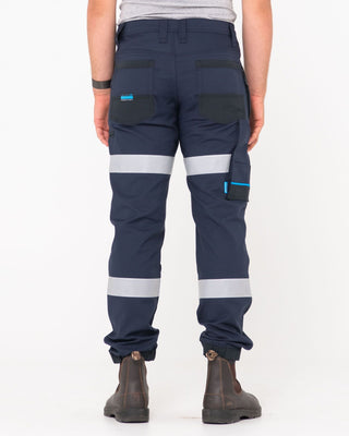 Man wearing Tr246r 9 Pkt Stretch Cuff Pant Reflect in True Navy