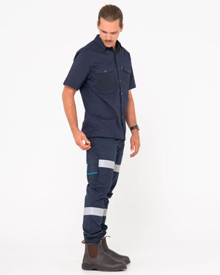 Man wearing Tr246r 9 Pkt Stretch Cuff Pant Reflect in True Navy