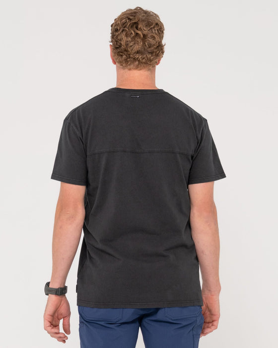 man-wearing-elbow-grease-short-sleeve-tee-in-black
