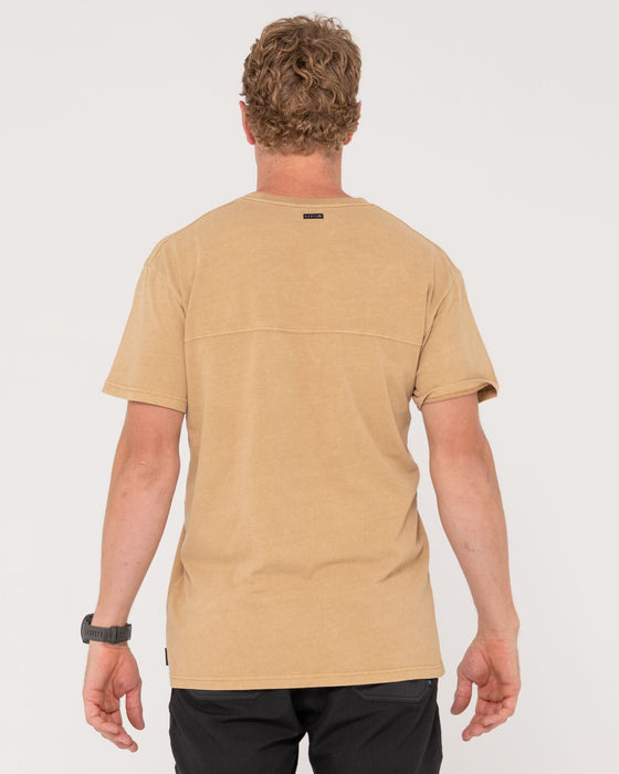 man-wearing-elbow-grease-short-sleeve-tee-in-khaki