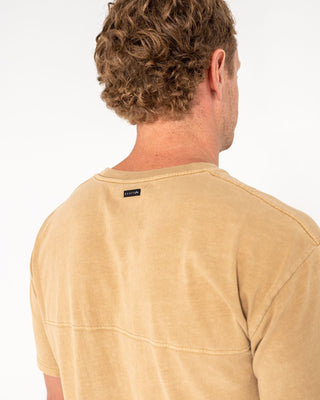 Man wearing Elbow Grease Short Sleeve Tee in Khaki