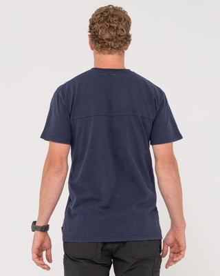 Man wearing Elbow Grease Short Sleeve Tee in Navy Blue