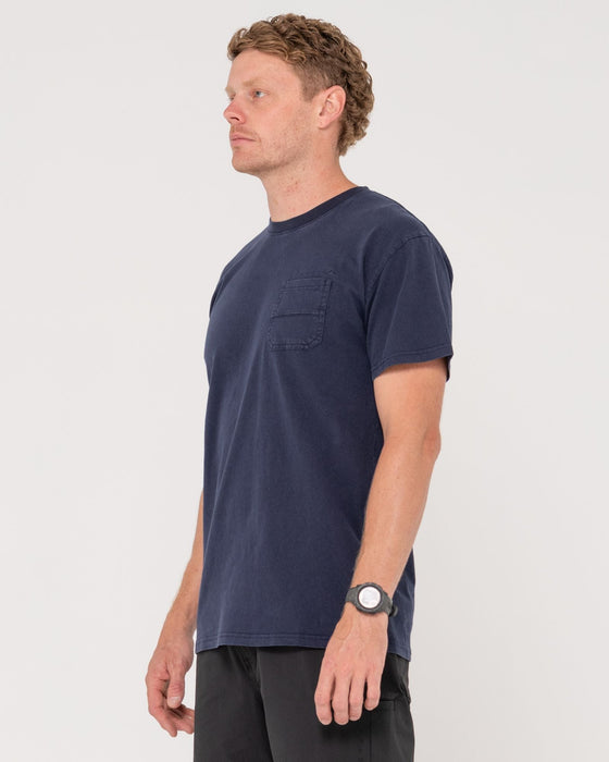 man-wearing-elbow-grease-short-sleeve-tee-in-navy-blue