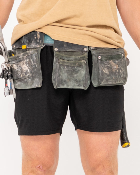 man-wearing-surf2site-quick-dry-elastic-work-short-in-black