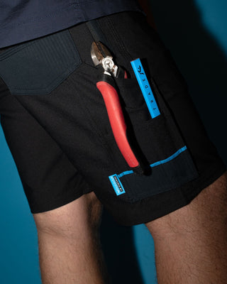 Man wearing Tr400 9 Pocket Stretch Short in Black