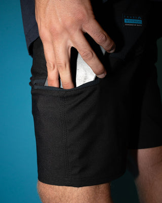 Man wearing Tr400 9 Pocket Stretch Short in Black