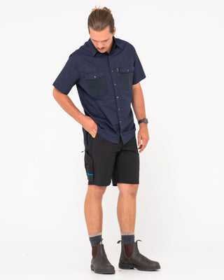 Man wearing Tr400 9 Pocket Stretch Short in Black