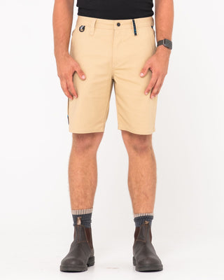 Man wearing Tr400 9 Pocket Stretch Short in Trade Khaki