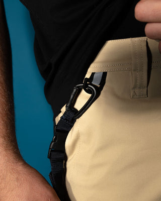 Man wearing Tr400 9 Pocket Stretch Short in Trade Khaki