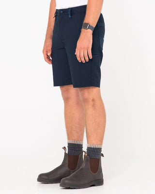 Man wearing Tr400 9 Pocket Stretch Short in True Navy