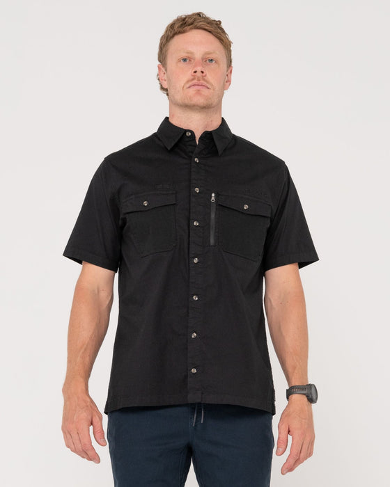 man-wearing-pressure-short-sleeve-shirt-in-black