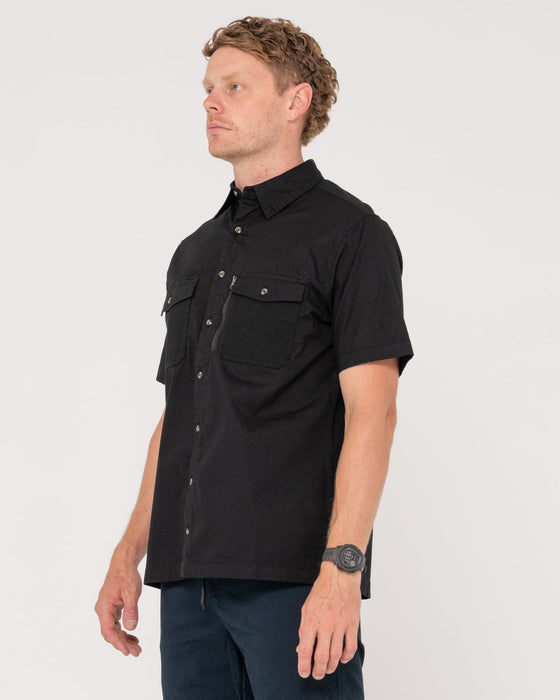 man-wearing-pressure-short-sleeve-shirt-in-black