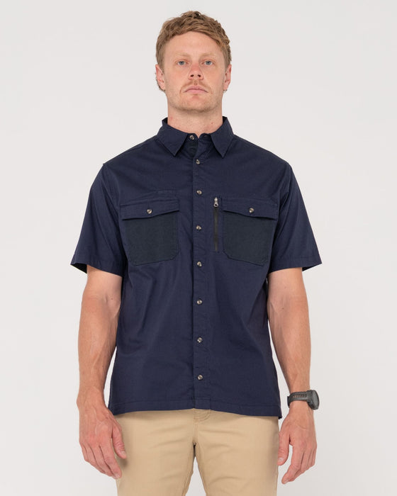man-wearing-pressure-short-sleeve-shirt-in-navy-blue