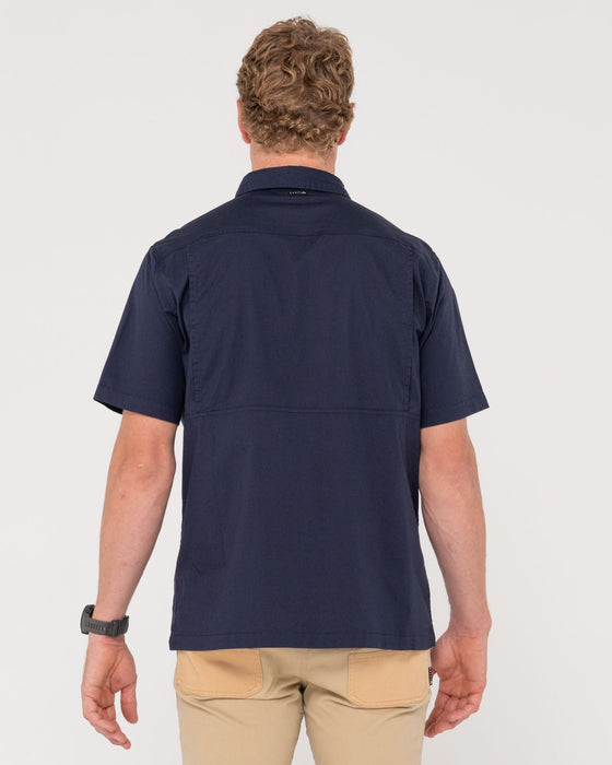 man-wearing-pressure-short-sleeve-shirt-in-navy-blue