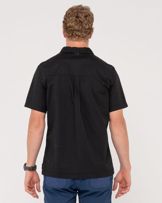 man-wearing-grindstones-short-sleeve-shirt-in-black