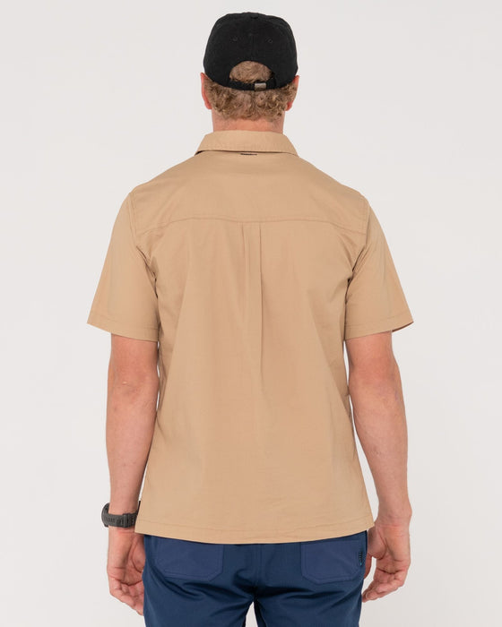 man-wearing-grindstones-short-sleeve-shirt-in-khaki
