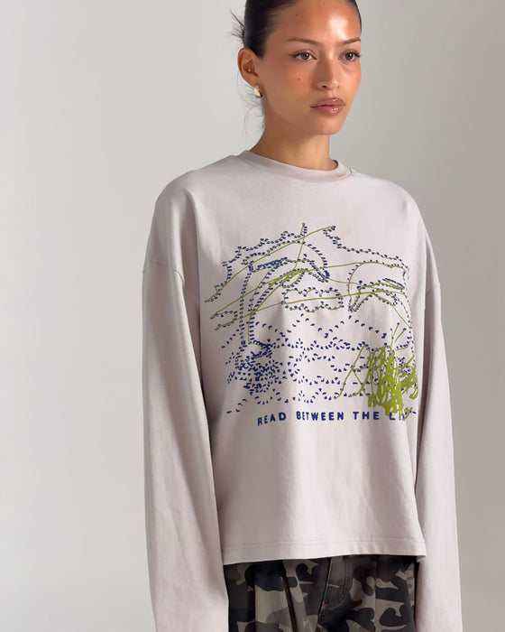 woman-wearing-coco-long-sleeve-relaxed-tee-in-oyster-grey